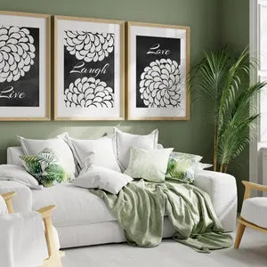 Mock up of the three panels in oak frames in a living room setting.