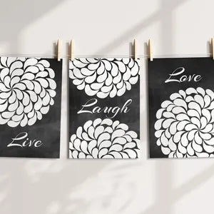 Mockup of the three panels as prints on photo paper hanging from a string and attached with clothespins.